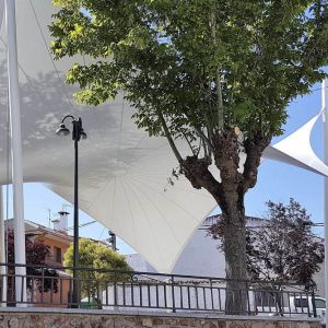 tensile cover with the shape of a hyperbolic paraboloid that covers the square of the town hall 